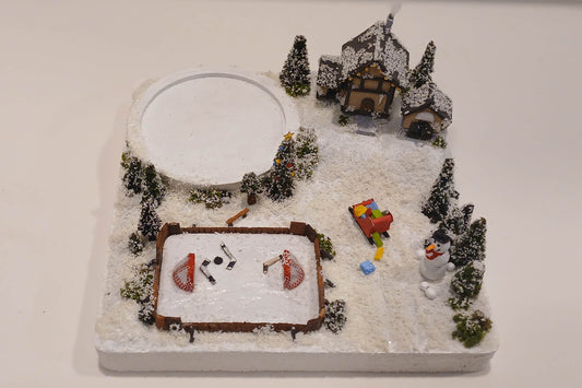 Miniature Ice Rink with Snowman, Sleigh of presents, white snow capped pine trees and a warm chalet.  Pot holder, model display, candle holder, diorama.