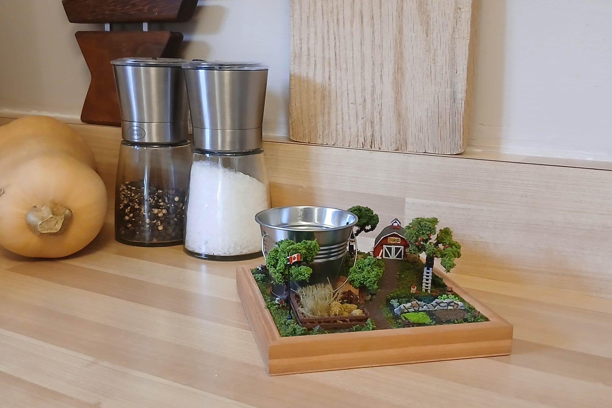 Miniature model farm scene with barn, trees, garden, field and pathways mounted within a wooden base  Pot holder, model display, candle holder, diorama