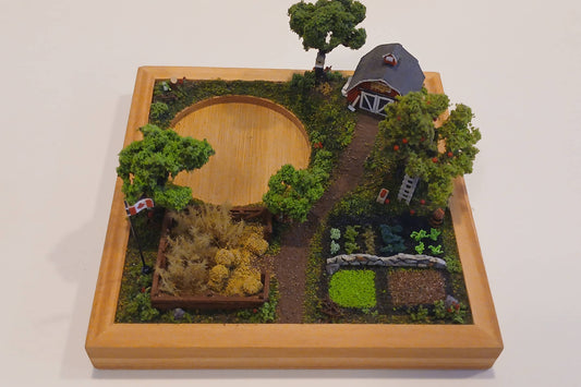 Miniature model farm scene with barn, trees, garden, field and pathways mounted within a wooden base  Pot holder, model display, candle holder, diorama